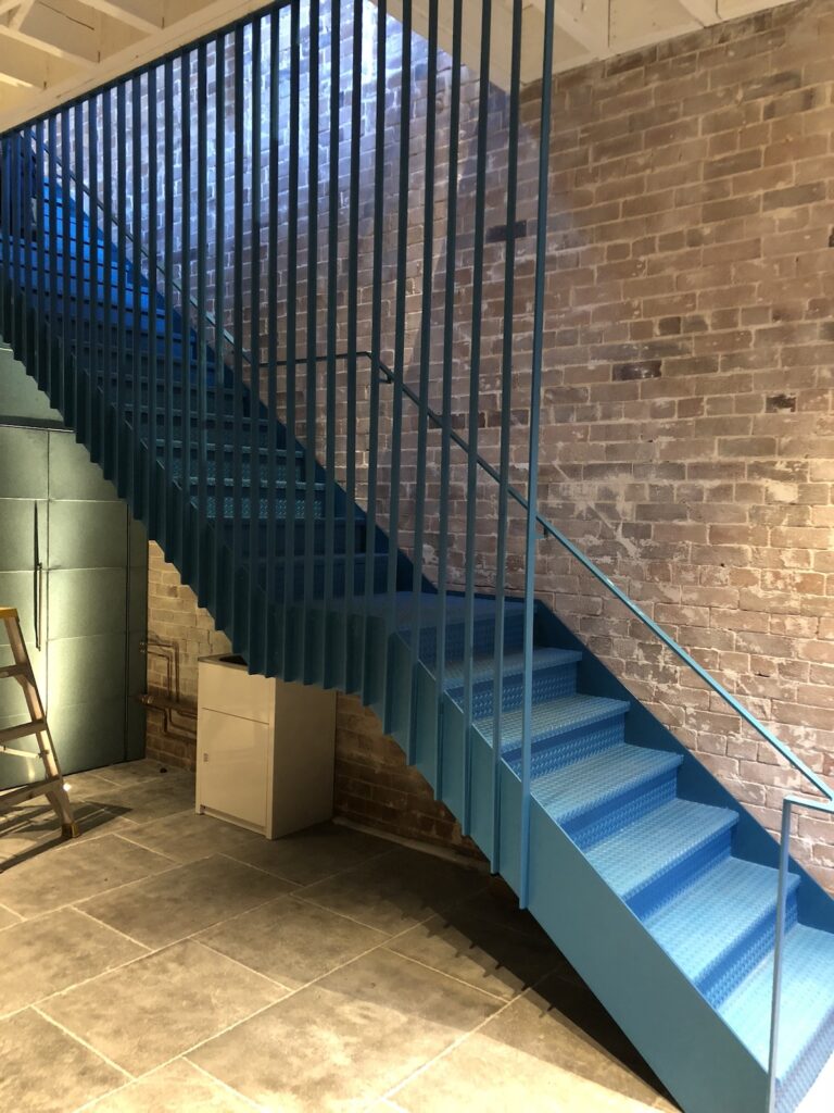 Commercial stainless steel staircase and balustrade fabricated by Toole Stainless Steel
